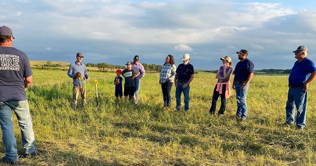 Ducks Unlimited Canada grazing clubs coordinator Mike Thiele leads farm tour in July 2022