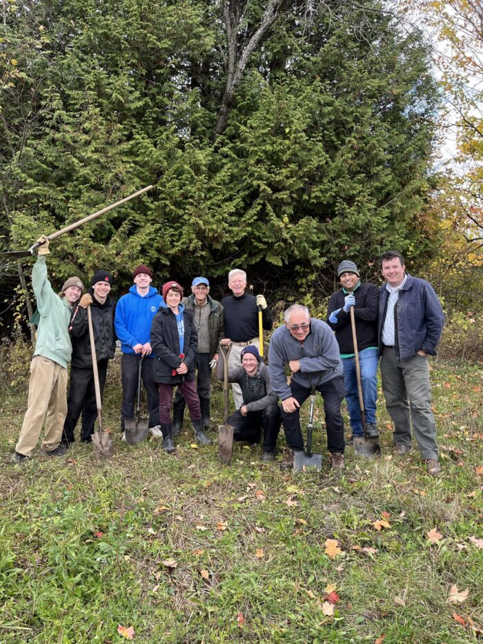 Shovels in hand, this dedicated crew of Ben Cullen's family and friends pitched in to plant a multitude of native trees to enhance the wetland.