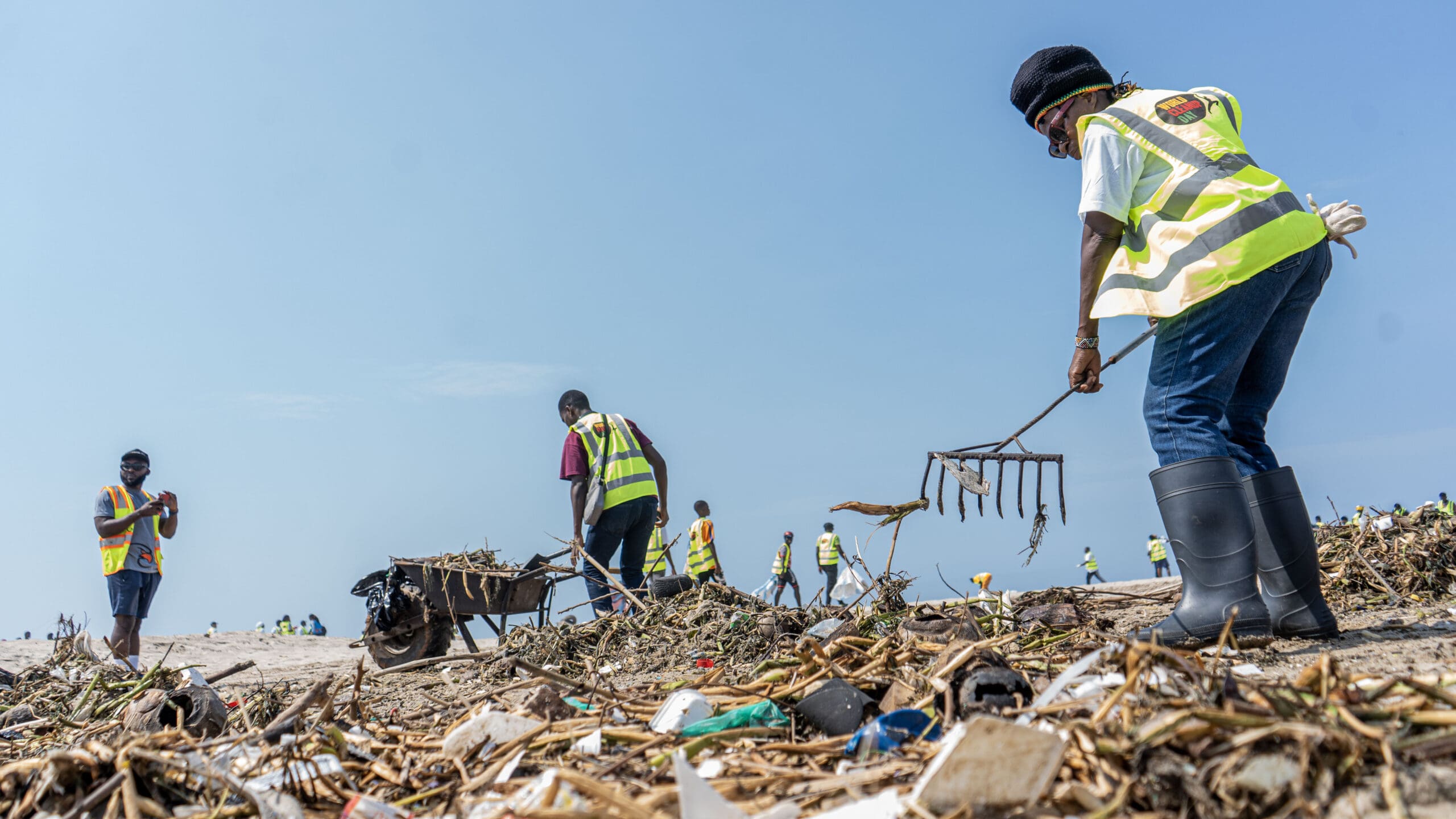 A group of people working to clean up waste.