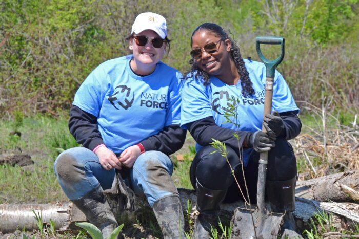 Staff from Nature Force partner organizations take part in tree-planting at a Ducks Unlimited Canada wetland restoration project in southern Ontario.